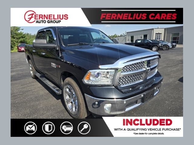 2018 RAM 1500 Laramie in Brilliant Black Crystal Pearlcoat — front three-quarter view
